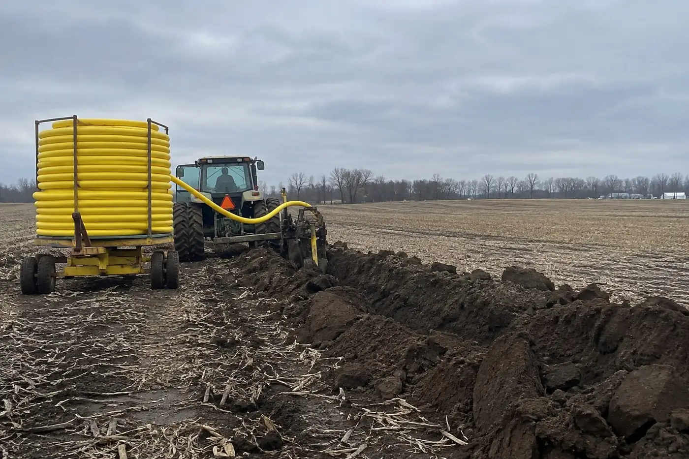 Drainage tile installation along an Ohio field edge near Dayton, OH