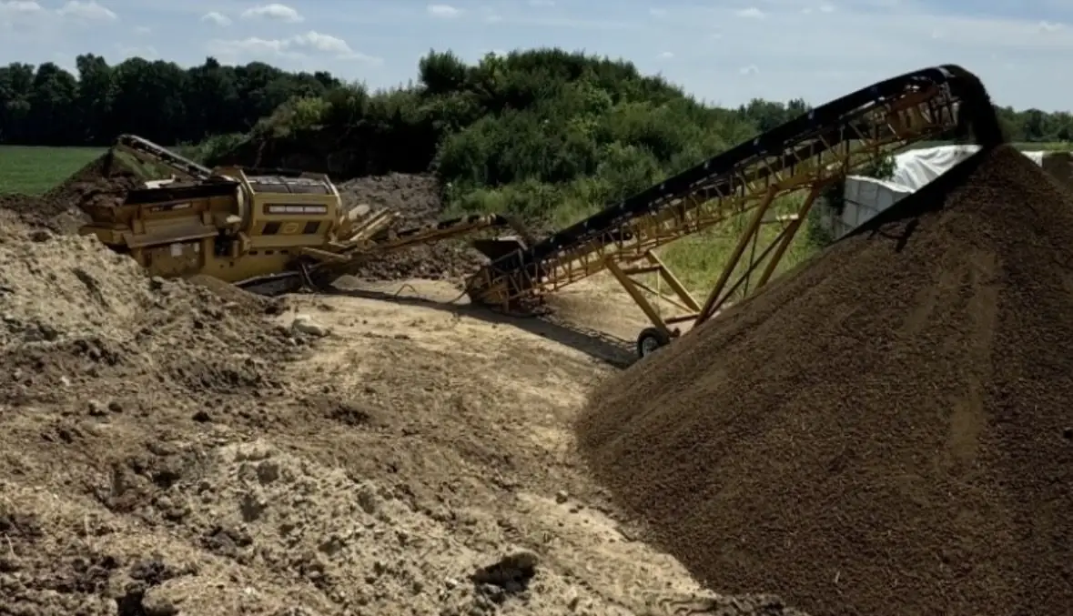 Conveyor stacking a fresh pile of blended topsoil near Dayton, OH